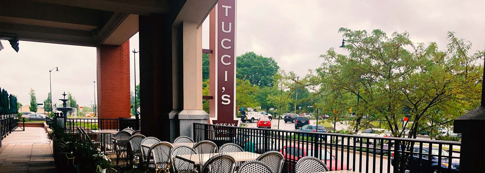 Exterior view of Tucci's patio and signage at Carmel City Center, Indiana.